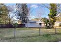 Cute light blue house with a fenced yard and mature trees at 2906 4Th St, Orlando, FL 32820