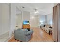 Bright living room with hardwood floors and comfy seating at 8009 Applehill Ct, Orlando, FL 32810