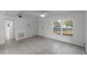 Living room with tile floors and plenty of natural light at 2313 Savoy Dr, Orlando, FL 32808