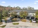 Aerial view of townhomes showing well-maintained exteriors, landscaped yards, and convenient parking in a desirable neighborhood at 4457 Le Reve Ct, Kissimmee, FL 34746