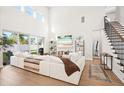Bright living room features high ceilings and large windows overlooking the backyard at 777 Halifax Ave, Winter Park, FL 32792