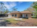 Charming single-story home featuring a one-car garage and well-maintained front lawn at 1740 Palm Rd, Ormond Beach, FL 32174