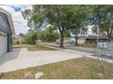 Charming neighborhood street view with mature trees and well-maintained lawns creates a welcoming atmosphere at 3076 Crane Strand Dr, Winter Park, FL 32792