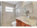 Updated bathroom with granite vanity, glass vessel sink, and walk-in shower at 733 Preble Ave, Altamonte Springs, FL 32701