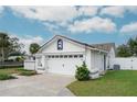 White garage door and well-maintained front yard at 1420 Moorland Ct, Longwood, FL 32750