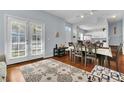 Open concept dining area with kitchen and access to backyard at 2203 San Vittorino Cir # 102, Kissimmee, FL 34741