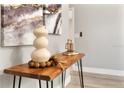 Tastefully decorated entryway featuring a wooden console table with elegant decor and modern artwork at 205 E 17Th St, Apopka, FL 32703