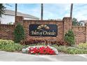 Isles of Oviedo community entrance with brick wall and landscaping at 1720 Garden Sage Dr, Oviedo, FL 32765