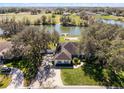 Aerial shot of a beautiful home with a tranquil lake view and private dock at 1845 Farrington Dr, Lakeland, FL 33809