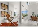 Bright living room with modern decor, floor-to-ceiling windows, and an open layout for seamless entertaining at 2661 Via Tuscany, Winter Park, FL 32789