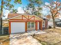 Newly built house with a attached garage and a small patio at 28 Spring Loop Cir, Ocala, FL 34472