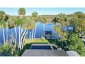 Overhead view of waterfront property featuring lush landscaping, private dock, and river access at 1043 Lemon Bluff Rd, Osteen, FL 32764