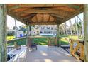 Covered private dock with seating offers tranquil views, a shady retreat, and waterfront living at 1043 Lemon Bluff Rd, Osteen, FL 32764