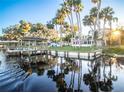 Lovely waterfront home with a dock and beautiful water views under a bright sky at 1043 Lemon Bluff Rd, Osteen, FL 32764