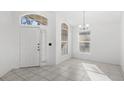 White door and tile floor near a sunny window at 230 Bay Meadow Dr, Kissimmee, FL 34746