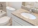 Updated bathroom with granite vanity and tile shower at 6929 Central Ave, Mulberry, FL 33860