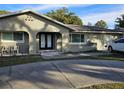 House exterior boasts a modern double door entry and well-manicured landscaping at 910 Rangeline Rd, Longwood, FL 32750