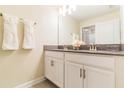 Bright bathroom featuring double sinks, modern fixtures, and neutral tones, offering a clean aesthetic at 8943 Cabot Cliffs Dr, Davenport, FL 33896