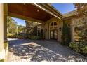 Grand covered entryway with double doors and a brick-paved walkway at 2115 Lake Crescent Ct, Windermere, FL 34786