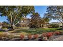Beautiful two-story home with manicured landscaping and circular driveway at 2115 Lake Crescent Ct, Windermere, FL 34786