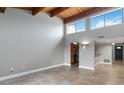 Inviting living room with vaulted ceiling and exposed wood beams at 510 Cranes Way # 306, Altamonte Springs, FL 32701