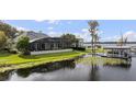 Luxury home on lake with private dock and lush landscaping at 6009 Lady Bet Dr, Orlando, FL 32819