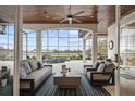 Open living room with high ceilings, large windows, and outdoor views, perfect for entertaining at 6009 Lady Bet Dr, Orlando, FL 32819