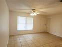 Bright living room featuring tile floors, ceiling fan, and a window that gives lots of natural light at 849 Orange Oak Dr, Orange City, FL 32763