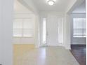 Bright entryway with tile floors and white door at 752 Sandy Bar Dr, Winter Garden, FL 34787