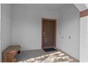 Cozy front porch with a bench, offering a welcoming entrance to the home at 1574 Slice Way, Davenport, FL 33896