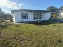 Newly renovated home with a fountain and well-maintained lawn at 1625 Hastings Dr, Deltona, FL 32725