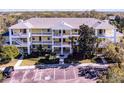 Three story condo building with mature landscaping and ample parking at 411 Lucaya Loop # 411, Davenport, FL 33897