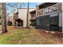 Private backyard with screened patio and grassy area at 5316 Pebble Beach Dr # E, Orlando, FL 32811