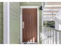 Inviting condo front door with olive green siding and white trim offers a warm welcome at 608 Gran Bahama Blvd # 608, Davenport, FL 33897