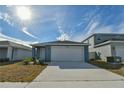 Two-car garage and freshly paved driveway in front of the house at 4815 Rigging St, Haines City, FL 33844