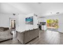 Open-concept living area featuring hardwood floors and sliding doors to the outdoors at 4535 Arch St, Orlando, FL 32808