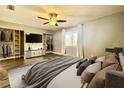 Spacious bedroom with large window, walk-in closet, and media console at 707 Saint Matthew Cir, Altamonte Springs, FL 32714