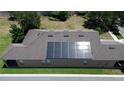 Aerial view of roof with solar panels, showing an environmentally conscious home upgrade at 15531 Waterleigh Cove Dr, Winter Garden, FL 34787