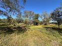Vacant lot with mature trees and lush vegetation at 6301 State Road 60 E, Bartow, FL 33830