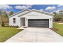 Lovely single Gathering house with a two-car garage, a well-maintained lawn, and appealing curb appeal at 12561 Sw 81St St, Dunnellon, FL 34432