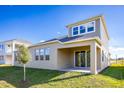 Two story home with covered patio and fenced backyard at 686 Creeping Fig St, Apopka, FL 32703