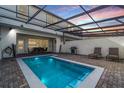 Private pool with covered lanai, perfect for outdoor relaxation and entertaining at 7420 Oakmoss Loop, Davenport, FL 33837