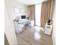 Bright and airy office space with modern desk setup and neutral decor for a productive work environment at 1208 Sawgrass Pointe Dr, Orlando, FL 32824