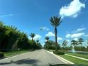 Residential street lined with lush tropical landscaping at 14501 Grove Resort Ave # 3640, Winter Garden, FL 34787