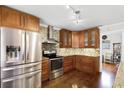 Modern kitchen with stainless steel appliances and granite countertops at 626 Little Wekiva Rd, Altamonte Springs, FL 32714