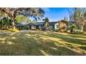 Ranch style home with a large yard and mature trees at 647 Ridgewood Dr, Windermere, FL 34786