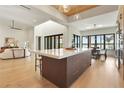 Bright and spacious kitchen with large island and modern appliances open to dining area and living room at 1340 Susannah Blvd, Orlando, FL 32803
