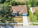 Expansive aerial view of a well-maintained home featuring a large roof, manicured lawn, and a spacious driveway at 2226 Lake Marion Dr, Apopka, FL 32712