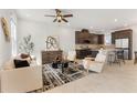 Bright and airy living room with modern furnishings, open floor plan, and stylish kitchen at 2097 Celebration Blvd, Celebration, FL 34747