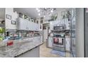 Modern kitchen with stainless steel appliances and granite countertops at 405 Mallard Ln, Kissimmee, FL 34759